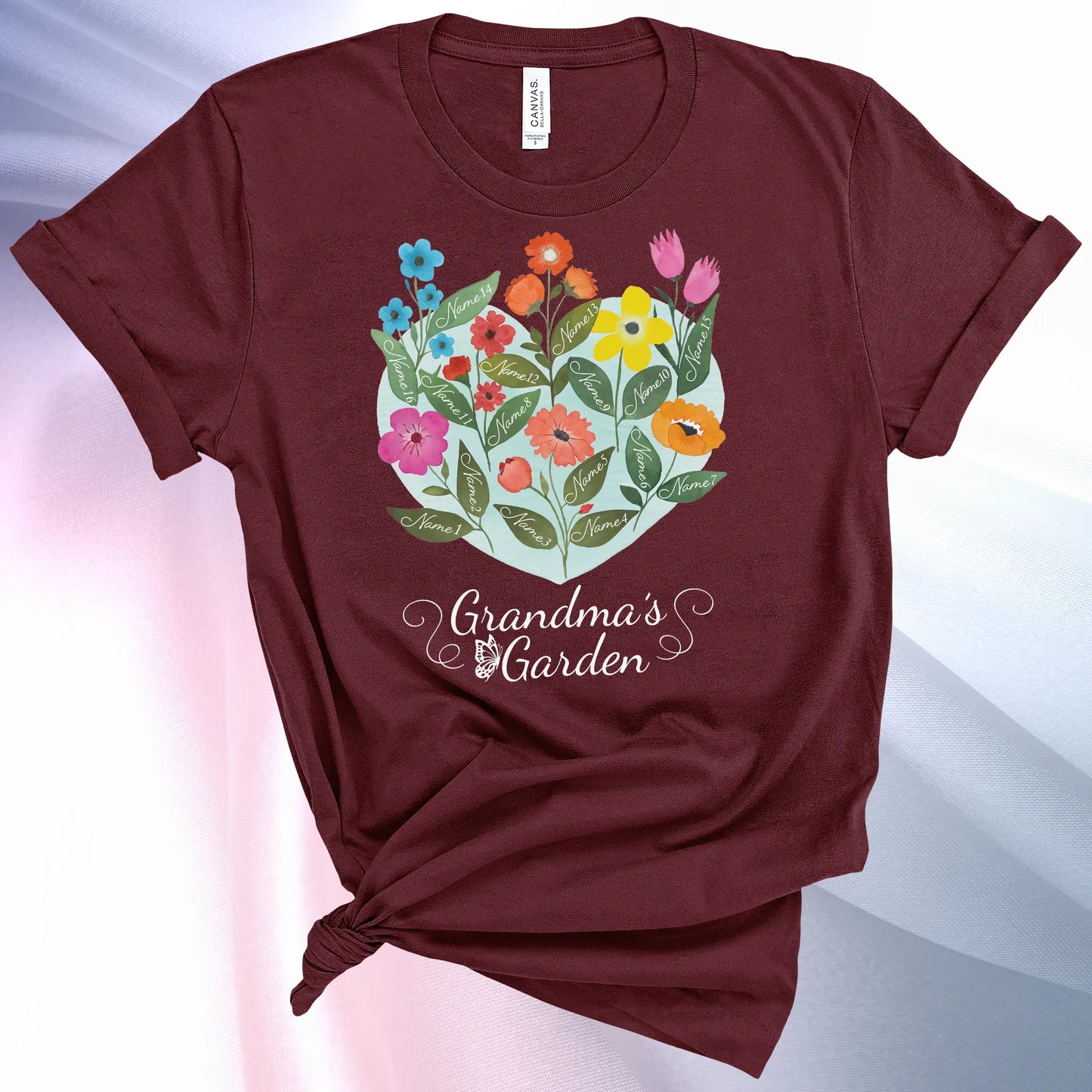Heather Team Purple colored Grandmas Garden T-Shirt for women, showcase up to 16 names on the leaves of beautiful flowers