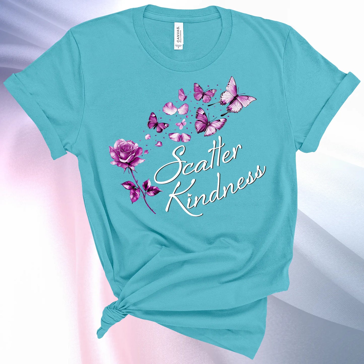 Turquoise colored Scatter Kindness T-Shirt for women, radiate positive vibes and make your world a little brighter!