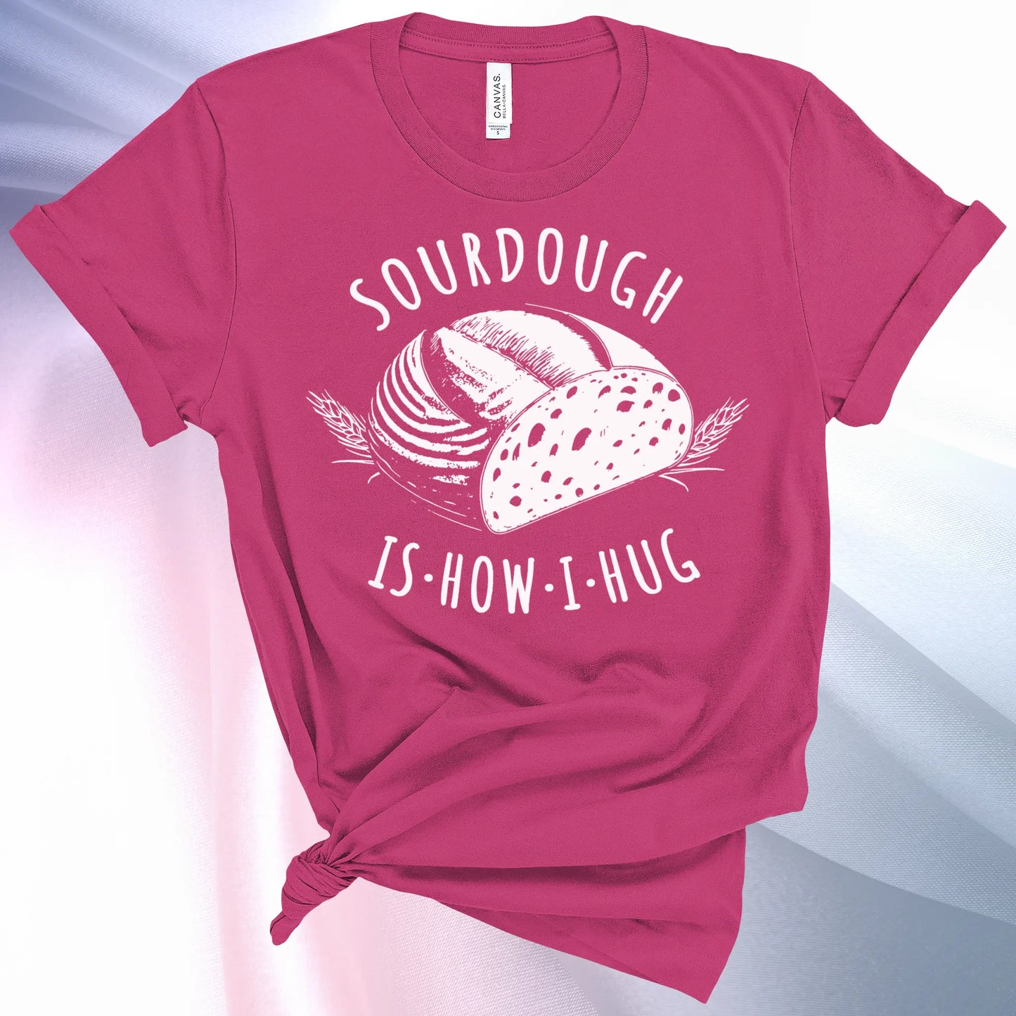 Berry colored Sourdough Hug T-Shirt featuring a loaf of sourdough and "Sourdough" above and "Is How I Hug" below