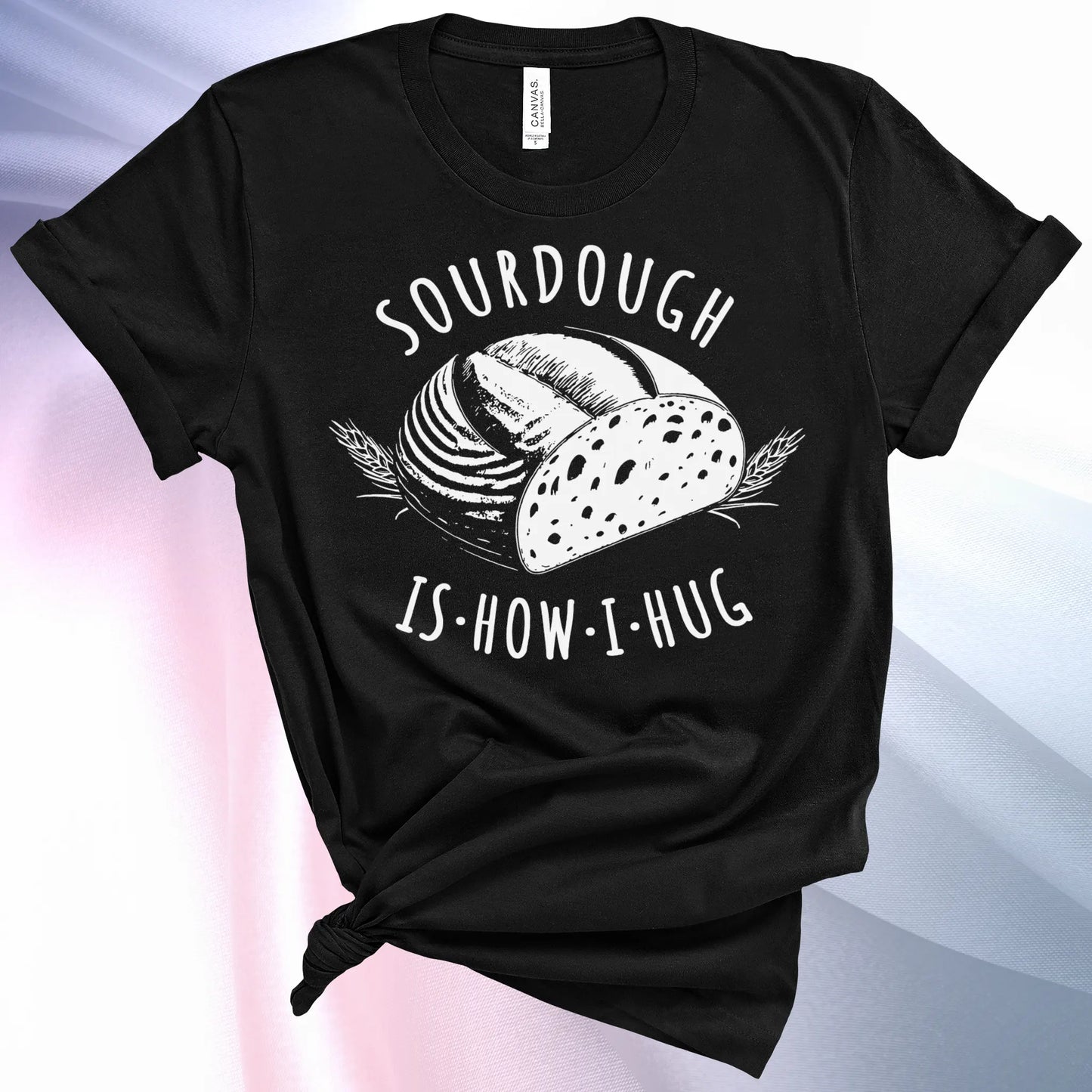 Black colored Sourdough Hug T-Shirt featuring a loaf of sourdough and "Sourdough" above and "Is How I Hug" below