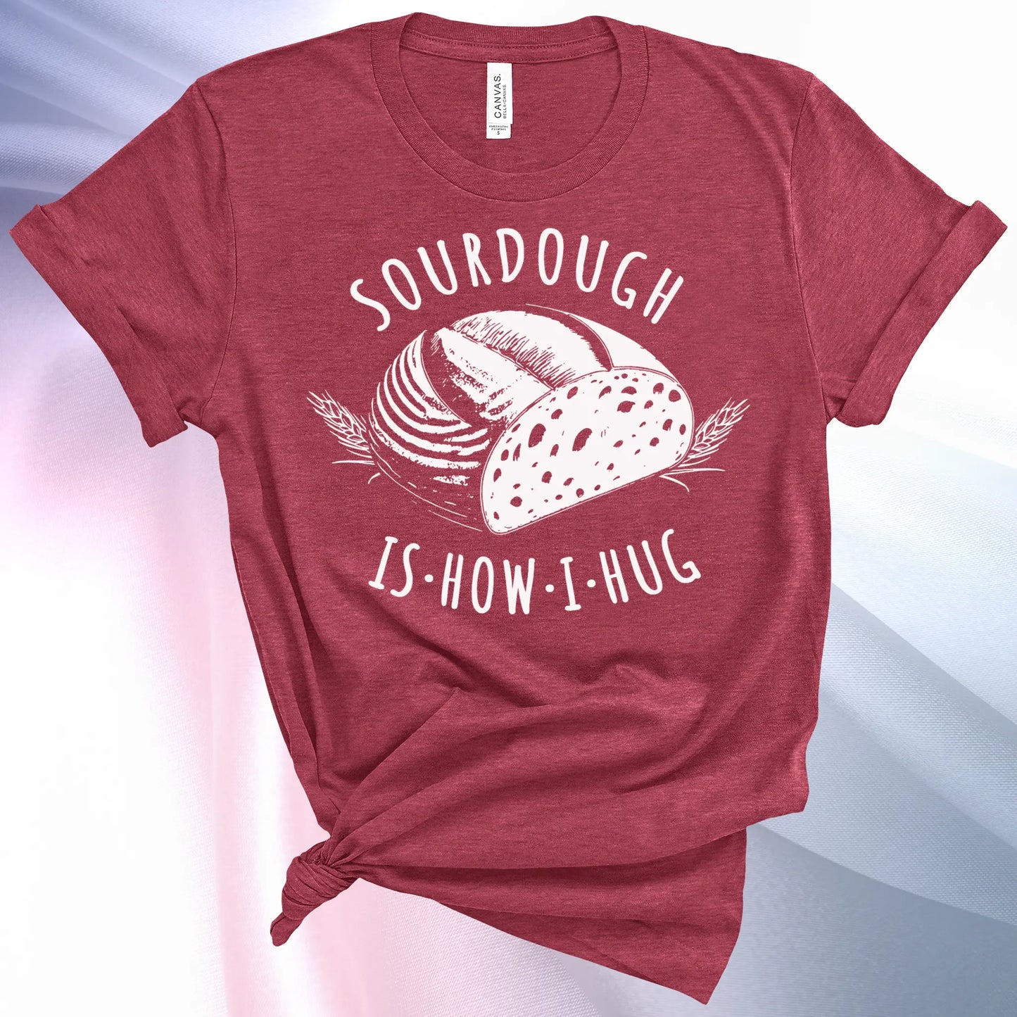 Heather Raspberry colored Sourdough Hug T-Shirt featuring a loaf of sourdough and "Sourdough" above and "Is How I Hug" below