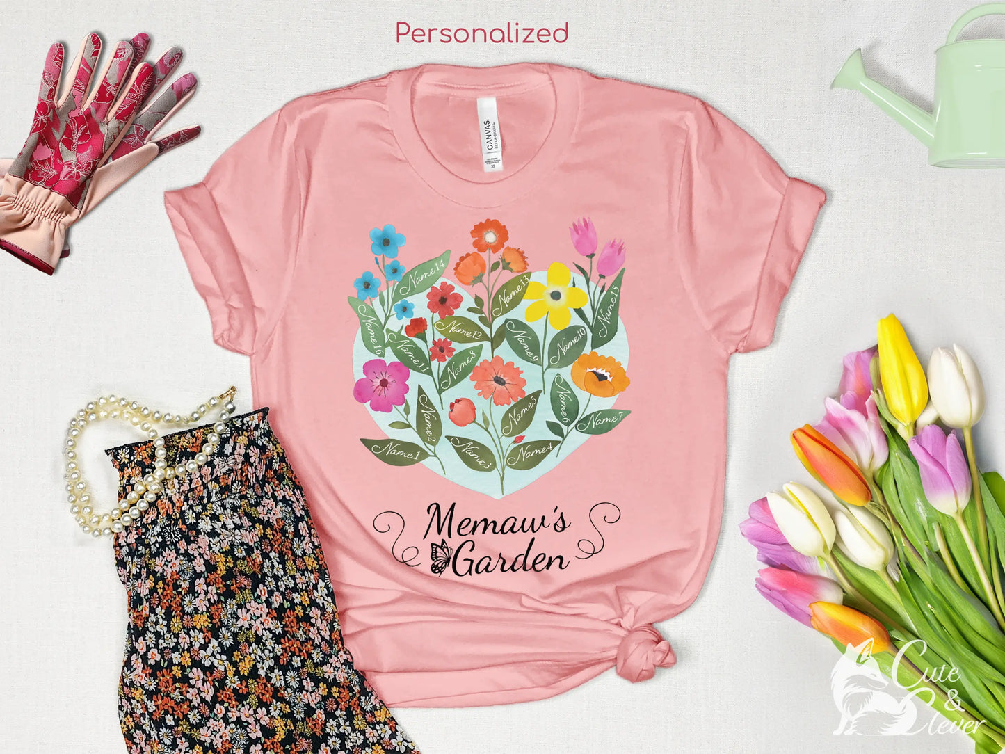 Pink Grandma's Garden T-Shirt for Women on white background with flowers, gloves, watering can, necklace, and skirt