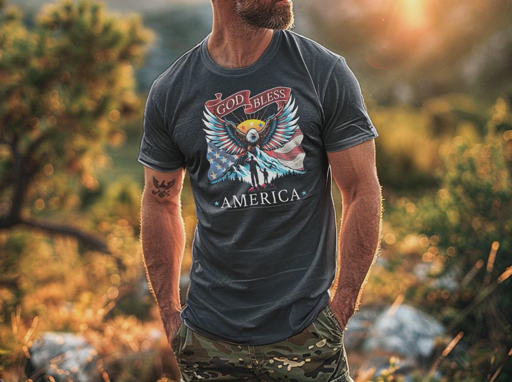 Man wears dark grey heather colored Patriotic T-Shirt for Men in rustic outdoor setting while eagle soars overhead.